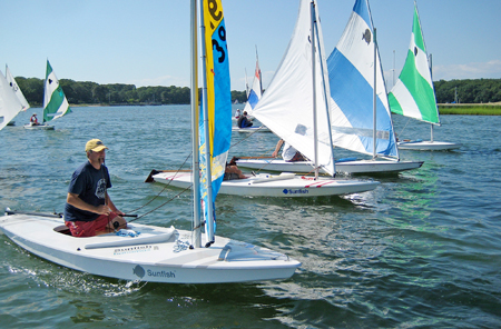 COURTESY ROBERT HARRRIS Sunfish racing by members of the Menantic Yacht Club.