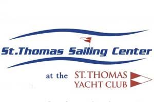 Logo for St. Thomas Sailing Center at the St. Thomas Yacht Club, featuring blue waves, red triangular flags, and the organization names in blue and red text.